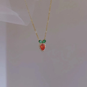 Sweet gold necklace with strawberry pendant featuring red heart stone and white zircons