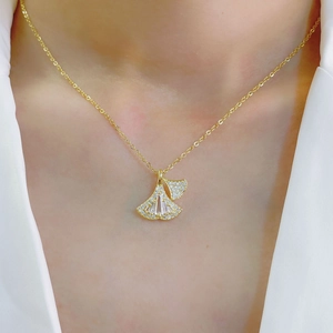 Elegant gold ginkgo leaf necklace featuring sparkling cubic zirconia for women