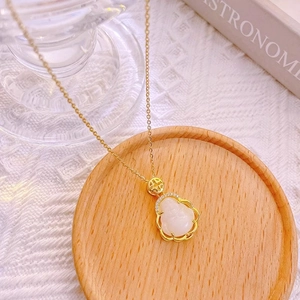 Exquisite white jade Buddha pendant necklace with gold plated chain and sparkling crystals
