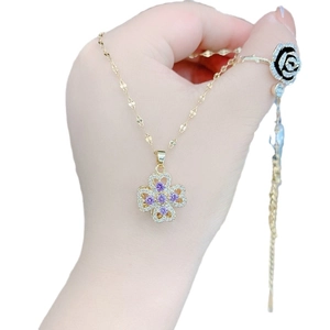 Rotating purple four-leaf clover necklace and black rose ring set in gold stainless steel