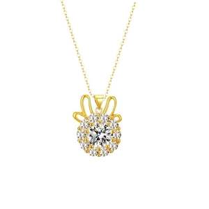 Detailed view of a gold necklace with round white zircon pendant and bow-shaped top design