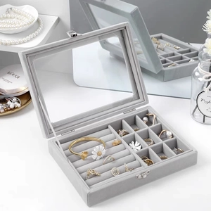 Large grey velvet jewelry box with transparent glass lid and multiple storage slots