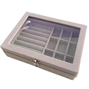 Light gray velvet jewelry box with glass lid and twelve-compartment ring organizer