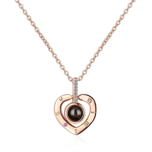 Rose gold heart pendant necklace with Roman numerals and projection stone on white background