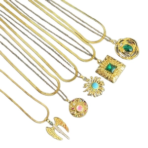 Vintage gold layered necklaces with bohemian pendants and colorful gemstone accents