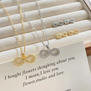 Infinity titanium steel jewelry set with full zircon inlay in gold and silver finish