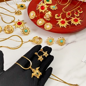 Vintage gold-plated jewelry set with crystal turtle pendant and matching accessories