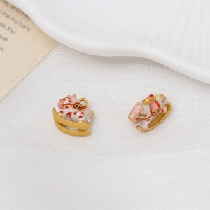 Detail of rocking horse pendants with gold finish and colorful enamel for DIY jewelry