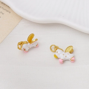 Detail of white enamel pegasus charms with gold wings for DIY jewelry making and crafts