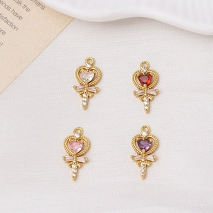 Detailed close-up of heart wand charms in four colors with zircon pavé details