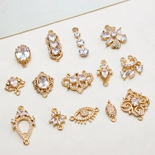 Macro shot of 14 gold plated jewelry charms with micro-inset zircons for DIY accessories