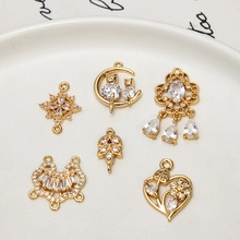 Detailed view of six gold-plated DIY pendants with cubic zirconia for jewelry making