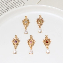 Detailed view of vintage gold baroque style pendants with colorful faceted stones