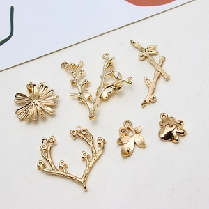 Gold plated copper pendants featuring flower leaf and branch designs for DIY jewelry