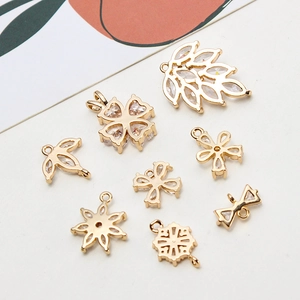 Golden flower and clover pendants with zircon stones for DIY necklace and earring making