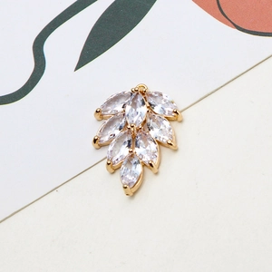 Macro shot of gold leaf pendant with marquise cubic zirconia for DIY jewelry making
