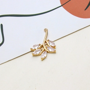 Detail showing a gold-plated flower branch pendant with six marquise cut cubic zirconia