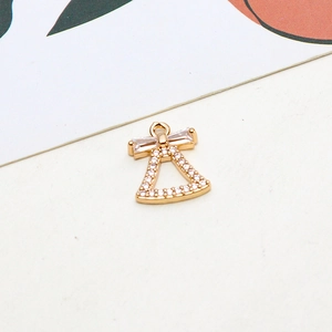 Golden bell pendant with zirconia stones and bow detail for DIY jewelry making