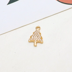 Detailed view of a gold Christmas tree pendant with micro-paved cubic zirconia stones