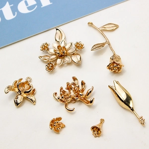 Golden flower charms set for DIY jewelry making including rose and lotus pendants