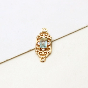Macro view of gold-plated rectangular blue zircon connector for DIY jewelry