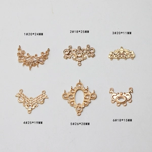Detailed flat lay of golden hollow flower jewelry connectors with micro zircon for DIY craft