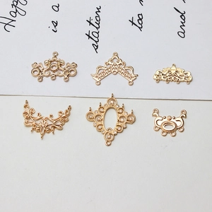 Golden DIY jewelry connectors in ornate hollow and filigree designs with cubic zirconia