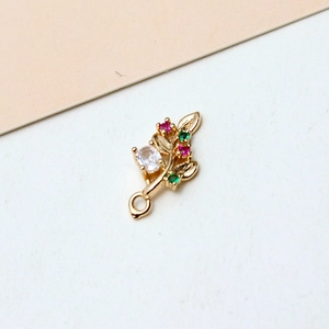 Detail of gold-plated leaf pendant with oval zircon and colorful crystal accents for DIY