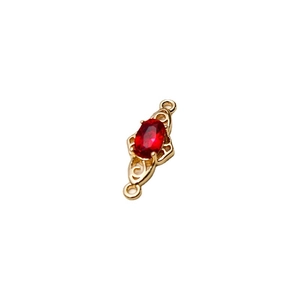 Gold-plated jewelry connector with red faceted gemstone and vintage scrollwork details