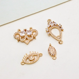 Macro shot of gold-plated cubic zirconia jewelry connectors for DIY earrings and necklaces