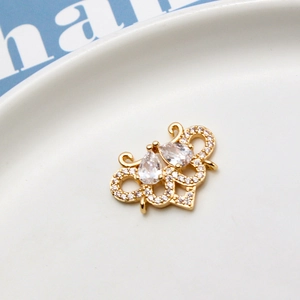 Macro shot of gold-plated crown pendant with cubic zirconia for DIY jewelry making