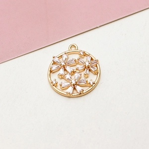 Detailed macro view of a gold-plated circular floral pendant with micro-set zircon stones