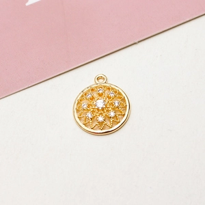 Close-up of gold plated hollow flower pendant with cubic zirconia for DIY jewelry