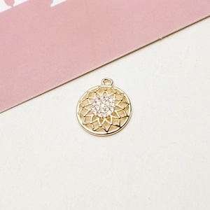 Close-up of 18K gold flower pendant with micro-set zircons for DIY jewelry making