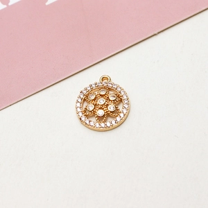 Close-up of gold-plated flower pendant with micro-pave cubic zirconia and top ring
