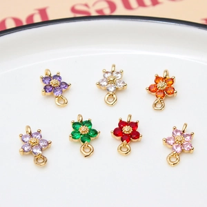 Set of seven gold-plated five-petal flower pendants with colorful cubic zirconia stones