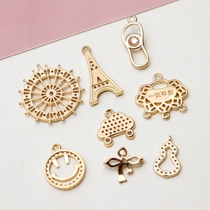 DIY vergoldete Schmuckanhänger-Set mit Eiffelturm, Schloss und Schleifen-Designs