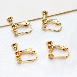 Detailed view of adjustable gold-plated screw ear clips for DIY jewelry making