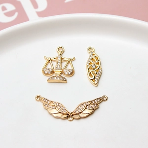 Gold-plated wing and star pendants with inlaid cubic zirconia for jewelry DIY crafting