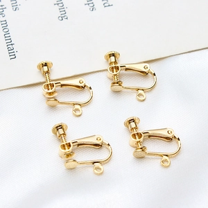 Detailed view of adjustable gold-plated screw ear clips for DIY jewelry making