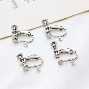 Close-up of adjustable silver U-shape screw earring clips for DIY jewelry making