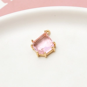 Macro shot of geometric pink crystal pendant with gold plating for DIY jewelry making