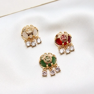 Pendentifs traditionnels chinois en cuivre doré avec glands en zircon en trois couleurs