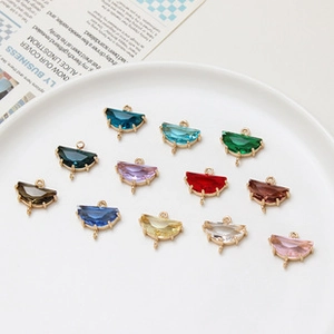 Close-up of 10x12mm colorful oval birthstone pendants with double loops for DIY jewelry making