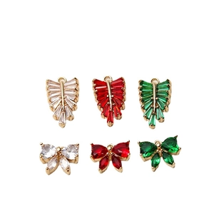 DIY jewelry pendants with leaf and bow shapes in gold finish with ziconia stones