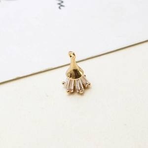 Detailed view of a gold-plated cone pendant with clear cubic zirconia insets