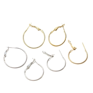 Polished gold and silver hoop earrings with lever back hooks in various sizes
