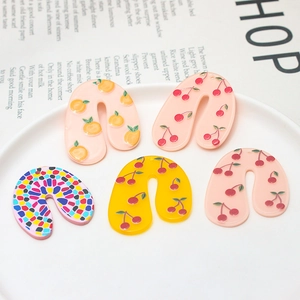 Five-piece acrylic U-shaped earrings set with summer fruit patterns in a ceramic plate