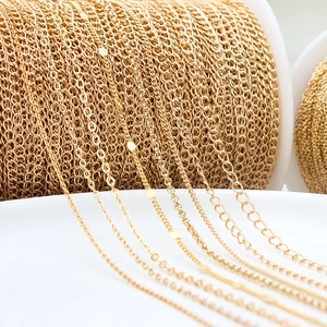 Close-up of assorted gold plated O-shaped and cross chains for DIY jewelry making