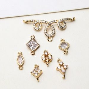 Macro view of geometric copper pendants with cubic zirconia for DIY jewelry making